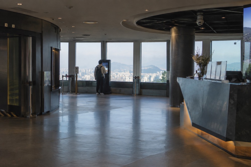The Plaza 5F level of N Seoul Tower with the observatory entrance and information desk
