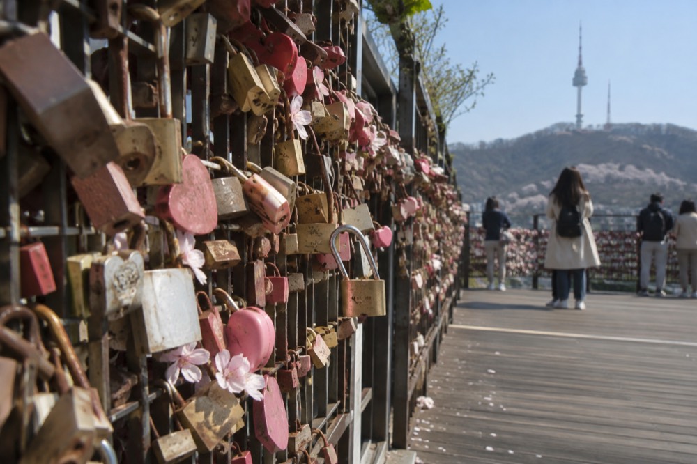 Padlocks attached to railings at the love lock deck on Namsan