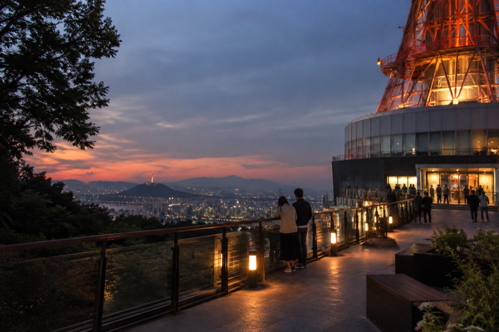 Seoul skyline seen from a terrace near the base of N Seoul Tower at dusk