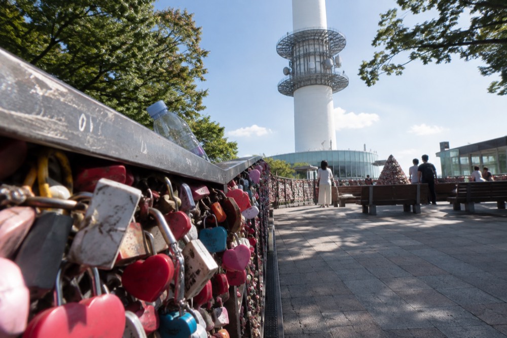 A visitor viewpoint on the Namsan summit with the tower base and railings