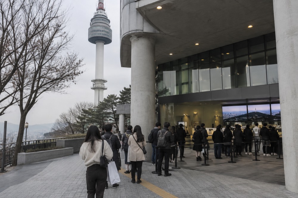 Observation deck entrance at plaza level with ticket desk and visitors