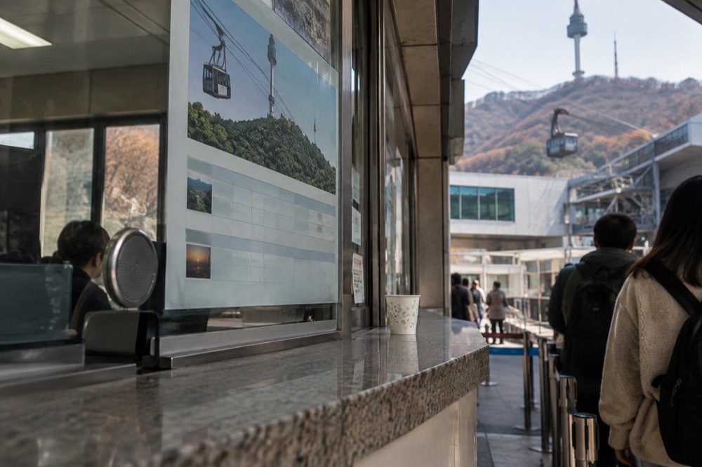 Cable car fare board and ticket windows at the Namsan lower station