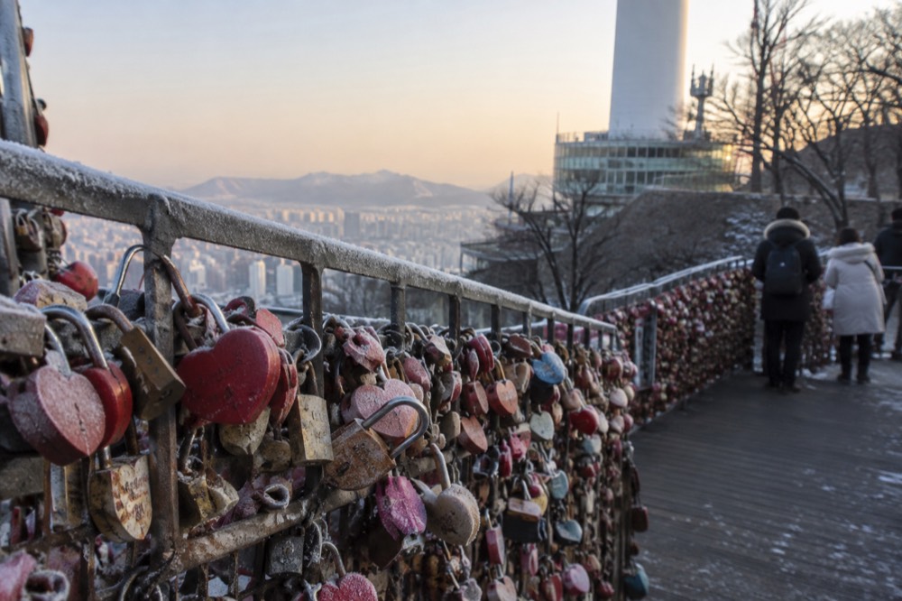 Padlocks attached to railings on the love lock deck at the Namsan summit in winter